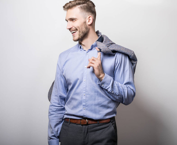 Elegant young handsome man in blue shirt with jacket. Studio fashion portrait.  - Φωτογραφία, εικόνα