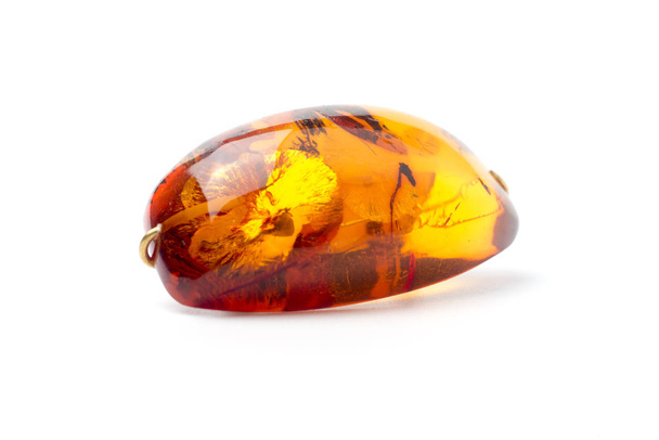 Amber brooch isolated on white background. - Photo, Image