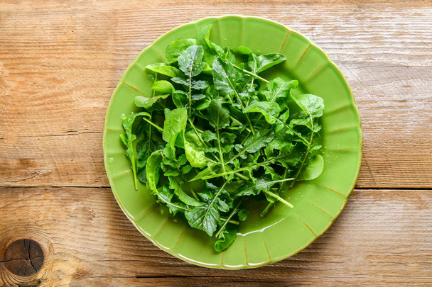 Fresh green home arugula leaves, rucola. Salad - Foto, afbeelding