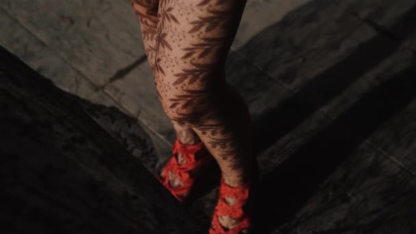 Closeup woman's legs with lace curtain pattern shadow and light rays / Closeup woman's legs standing close to the window with lace curtain pattern shadow and sun rays - video in slow motion - Footage, Video