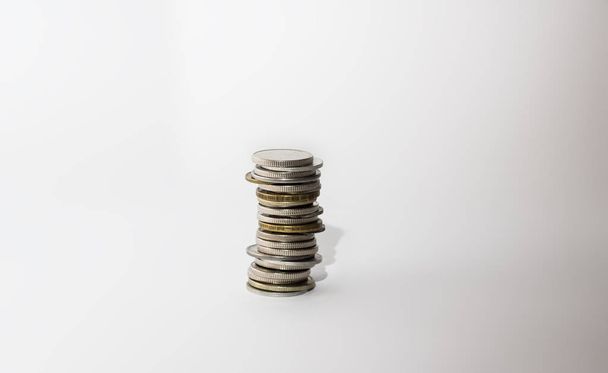 A stack of metal coins on a white background, isolate - Photo, Image