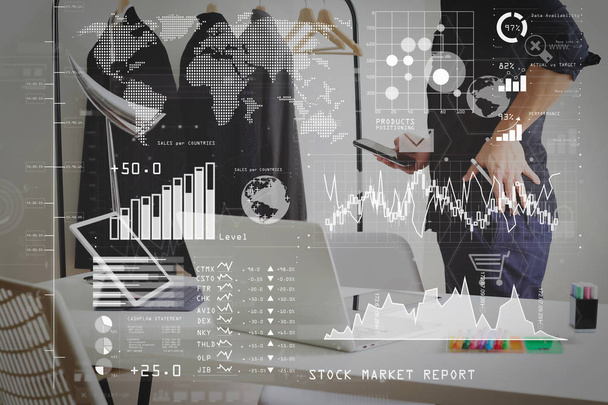 Investor analyzing stock market report and financial dashboard with business intelligence (BI), with key performance indicators (KPI).Fashion designer talking mobile phone and using laptop with digital tablet. - Photo, Image