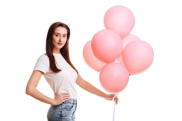 Happy young woman or teen girl in pink Tshort with helium air balloons - Foto, immagini