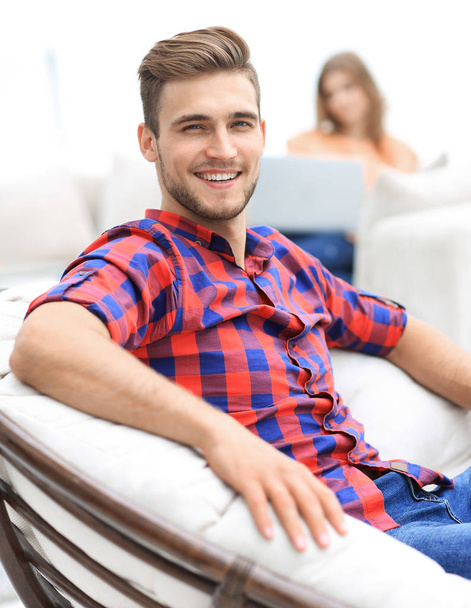 closeup of a successful young man sitting in a comfortable chair - Foto, Bild