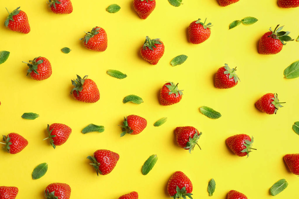 Flat lay composition with with tasty ripe strawberries and mint on color background - Фото, изображение
