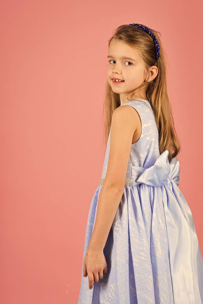 Fashion young kid model fece close up. Face female kid wiht happy emotion. Fashion and beauty, little princess. Look, hairdresser, makeup. Little girl in fashionable dress, prom - Zdjęcie, obraz