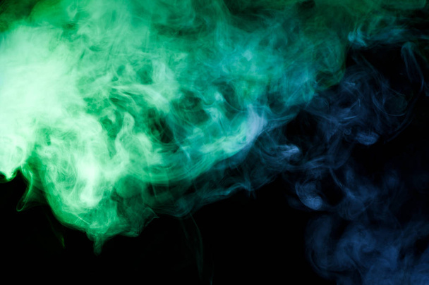 Blue and green  smoke on black backgroun - Photo, Image