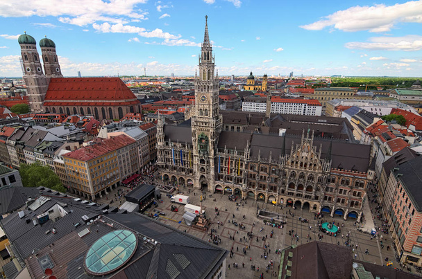Munich, Germany-APRIL 30, 2018: Ancient Marienplatz and New City Hall, Cathedral of Our Dear Lady (Munich Frauenkirche) aerial view in spring day. - Fotó, kép