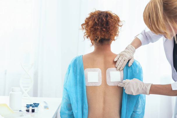 Hospital patient getting a back pain treatment - Valokuva, kuva