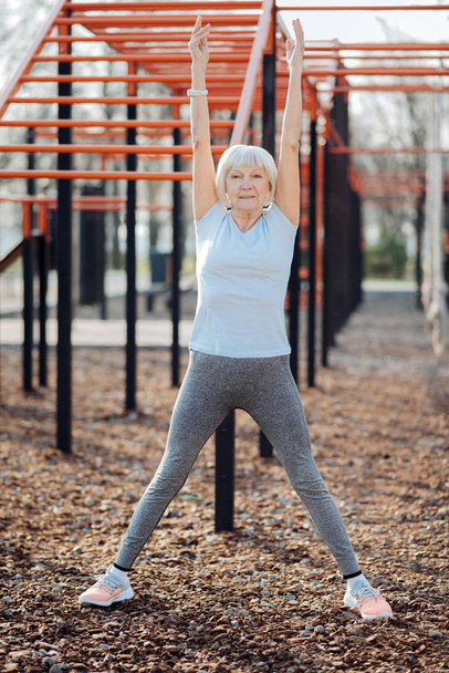 Happy athletic woman exercising outdoors - Foto, Imagem
