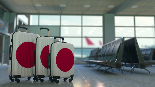 Utazási bőröndök, featuring Japán zászlaja. Japán turizmus fogalmi animáció - Felvétel, videó