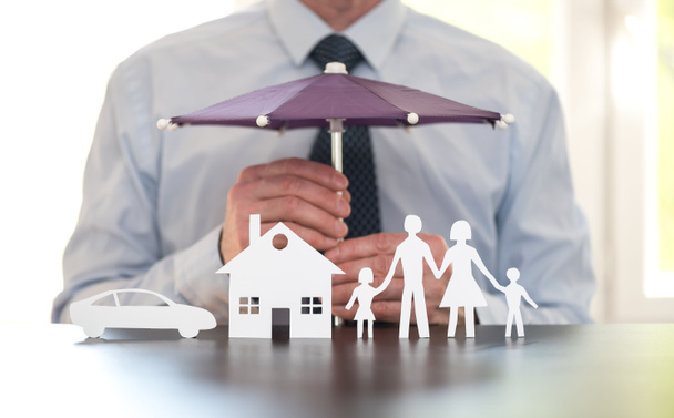 General agent protecting a family, a house and a car with his hands - Photo, Image
