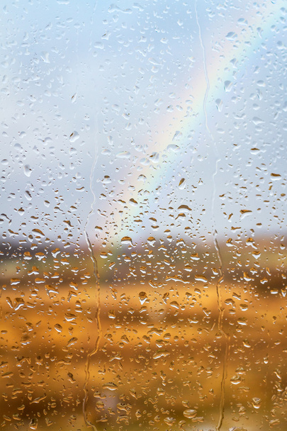 Rainbow through rained window - Foto, Bild