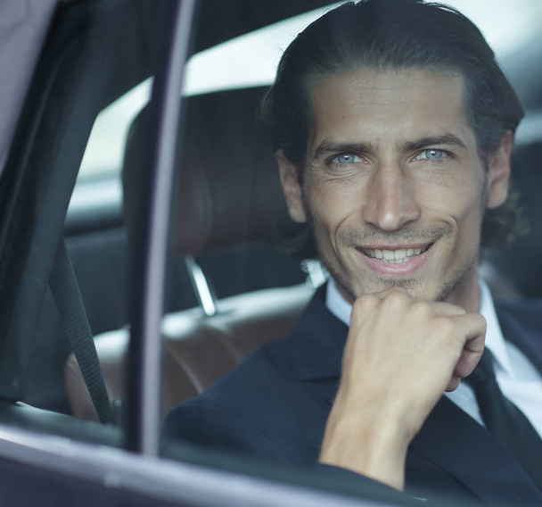 face of a businessman sitting in car - Photo, Image