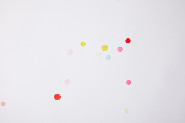 top view of colored confetti pieces isolated on white - Foto, Bild