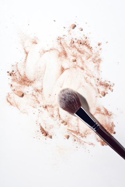 Make up powder and makeup brush on white background - Фото, изображение