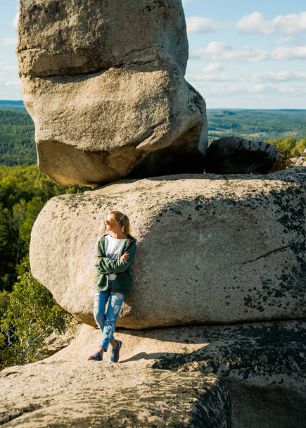 blond woman is standing on the summit on  beautiful sunny day - Foto, Bild