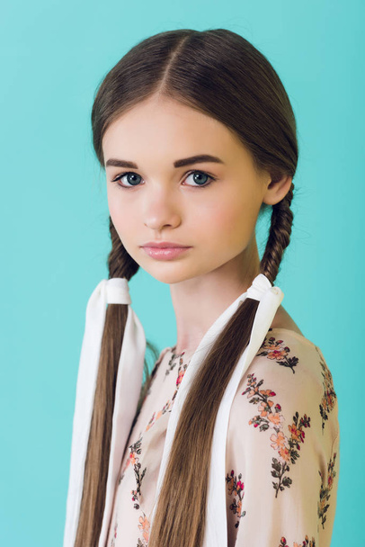 portrait of elegant youth girl with braids, isolated on turquoise - Photo, Image