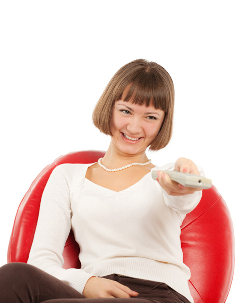 Happy young woman watching TV - Photo, Image