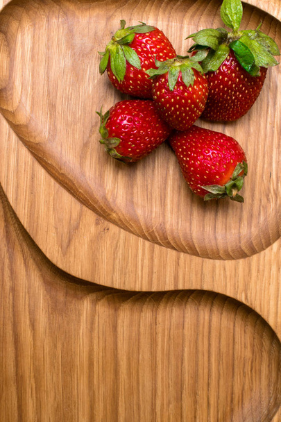 raw fresh strawberry in wooden background. Breakfast conception - Photo, image