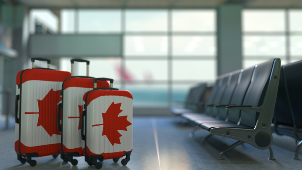 Podróżne walizki z flaga Kanady. Kanadyjski turystyka pojęciowy animacji - Materiał filmowy, wideo