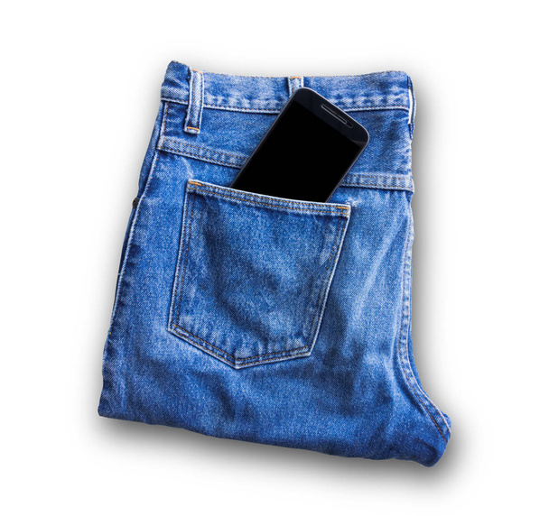 Modré džíny kapsa s smartphone izolovaných na bílém pozadí - Fotografie, Obrázek