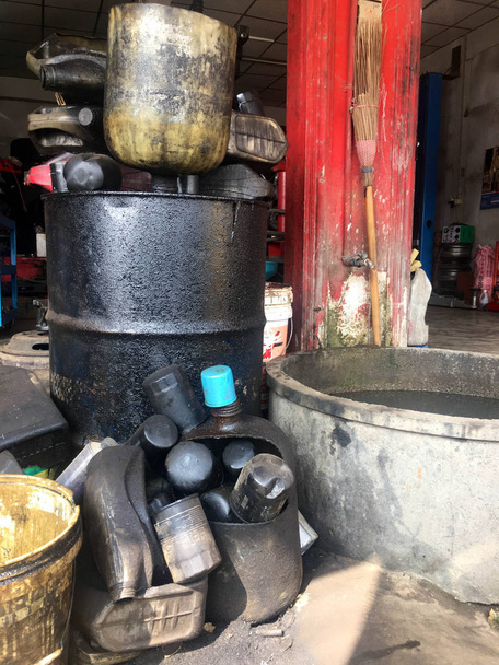Used engine oil tank And blue oil filter - Photo, Image