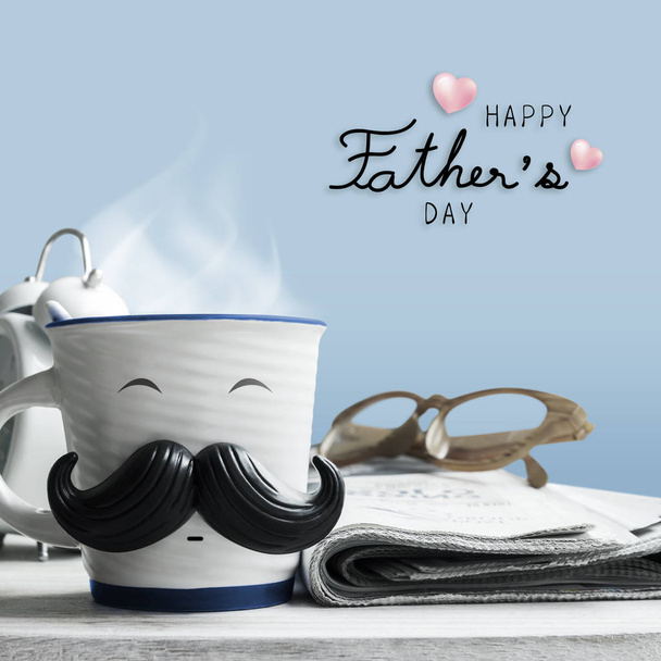 Father's day concept of coffee cup with mustache on wooden table - Photo, Image