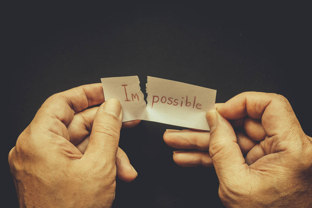 Tearing the word impossible on paper to possible - Photo, Image