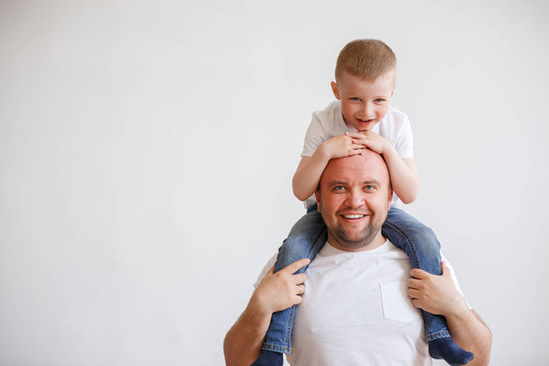 Image of young father with son on shoulders - Photo, image