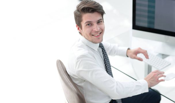 employee sitting in front of a computer screen - Foto, Imagen