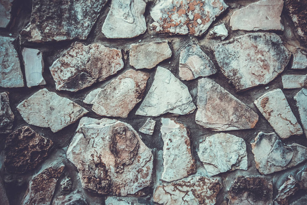 Sluiten van natuurstenen muur. Stenen muurstructuur  - Foto, afbeelding