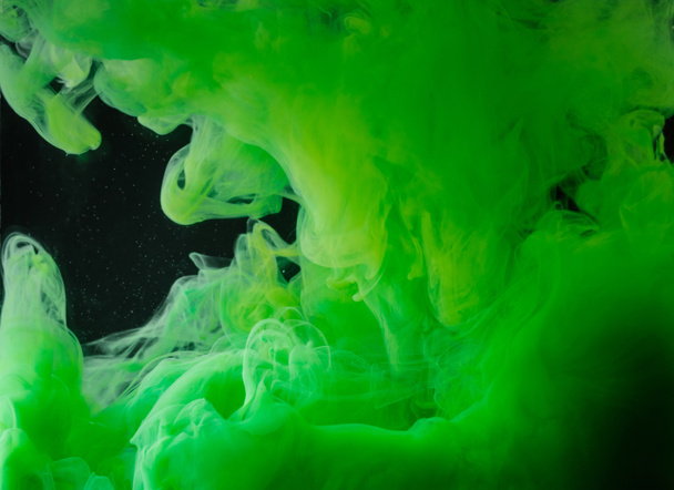 close-up view of bright green abstract ink on black background   - Photo, Image