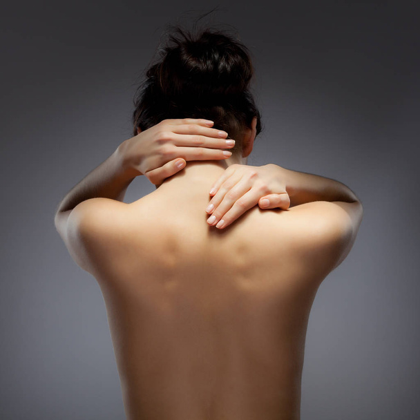 Woman massaging back pain - Fotoğraf, Görsel
