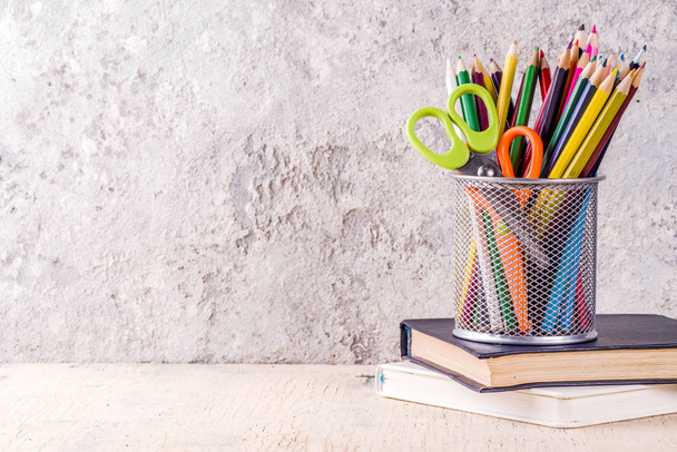 Back to school concept with pencils, school supplies and books, grey concrete background copy space - Photo, Image
