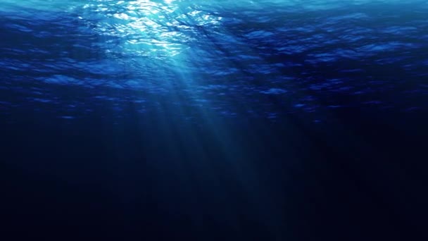 Onderwaterschijnwerpers lus zonnestralen doorbreken van zeewater - Video