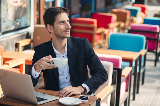 Somebody called young businessman with coffee - Photo, Image