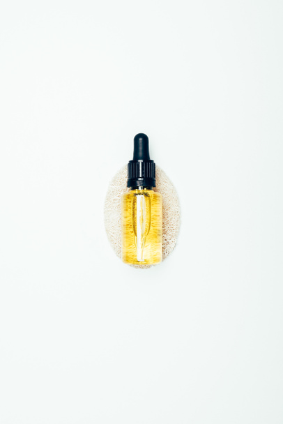 top view of cosmetic bottle with pipe and sponge isolated on white surface  - Valokuva, kuva