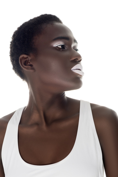 beautiful african american girl with white lips looking away isolated on white - Fotó, kép