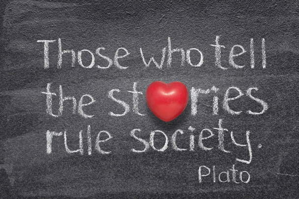 who tell stories famous quote of ancient Greek philosopher Plato written on chalkboard with red heart symbol instead of O - Photo, Image