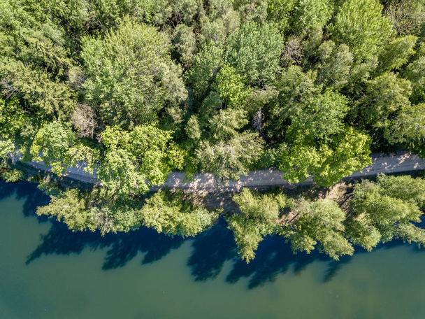 drone image. aerial view of rural area lake in forest with green water. latvia - Zdjęcie, obraz