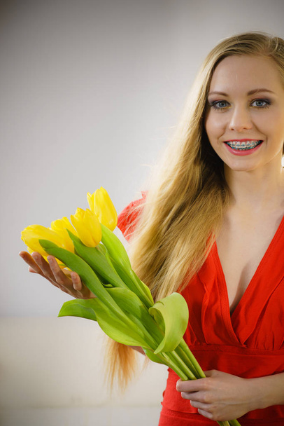 International women day, eight march. Beautiful portrait of pretty woman blonde hair with yellow tulips, fashion make up, elegant dress. Mothers day. - Foto, Imagen