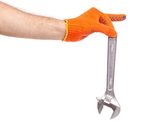 Adjustable wrench in hand construction gloves - Fotoğraf, Görsel
