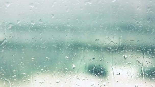 Océano detrás de la lluvia o gotas en ventana
 - Imágenes, Vídeo