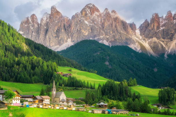 Dolomites Italy landscape at Santa Maddalena or St. Magdalena village with Geisler or Odle Dolomites Group. The beautiful mountain landscape attracts tourist to travel to Dolomites in Northern Italy. - Photo, Image