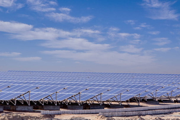 station of solar panels in the desert against blue sky - Фото, зображення