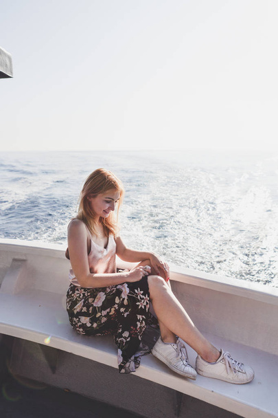 Happy young amazing woman wearing relaxing on the yacht in Cinque Terre, Italy, Ligurian Sea, outdoor - Zdjęcie, obraz