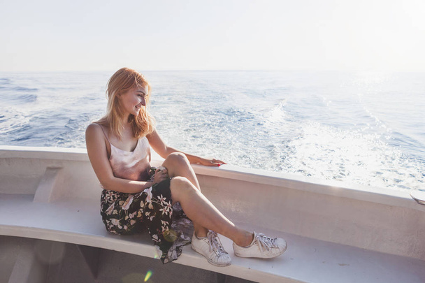 Happy young amazing woman wearing relaxing on the yacht in Cinque Terre, Italy, Ligurian Sea, outdoor - Photo, image