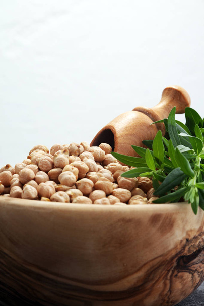 Raw Chickpeas on a bowl. Chickpeas is nutritious food. Healthy and vegetarian food - Fotó, kép