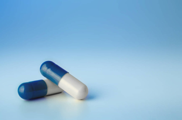 medical healthcare pills on blue background  - 写真・画像